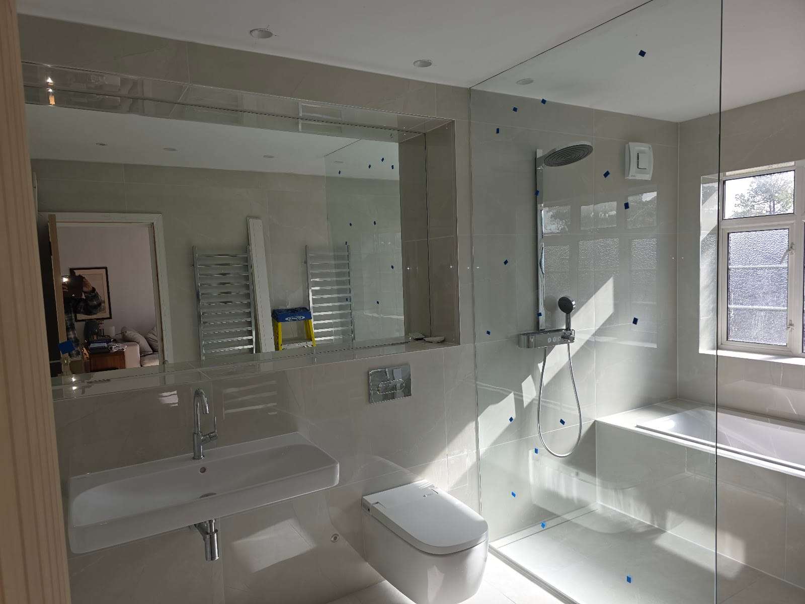 Frameless shower screen and mirror, by Original Petts Wood Glass Shop